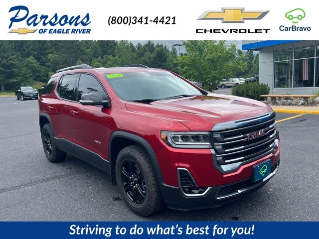 2023 GMC Acadia AT4 in Volcanic Red Tintcoat — front three-quarter view