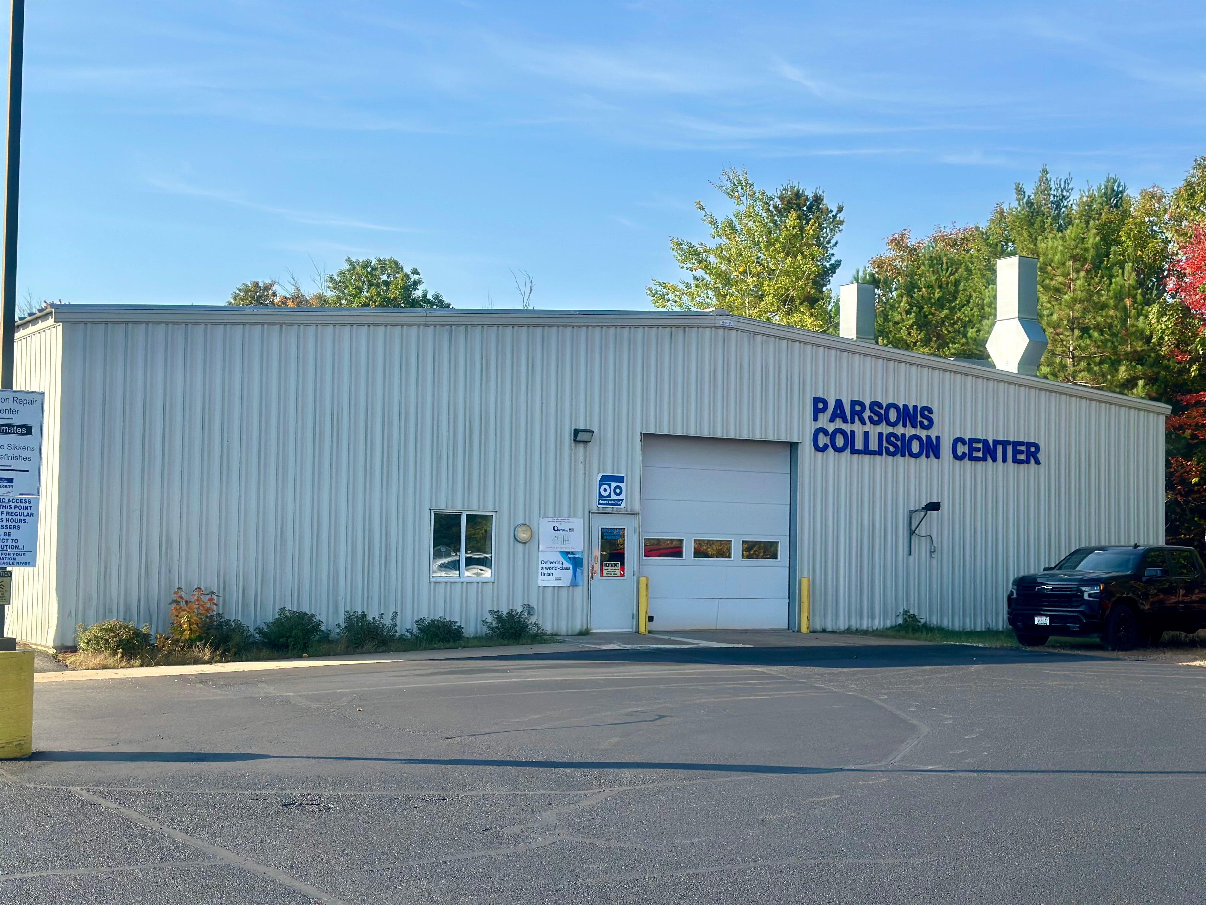 Parsons Collision Center Building offering repairs and free estimates